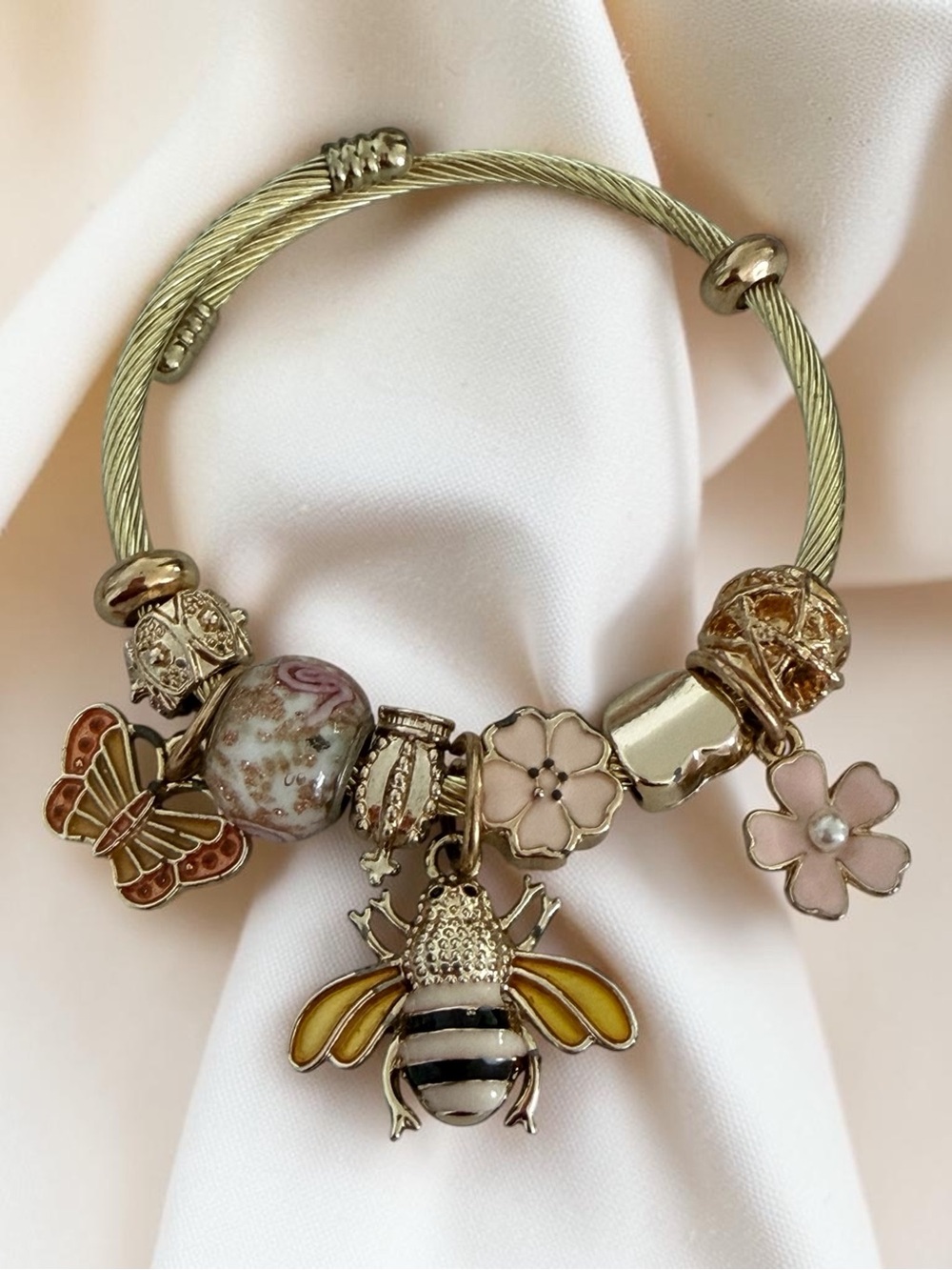 Gold-Tone Bee Charm Bracelet with Pink Floral and Butterfly Accents
